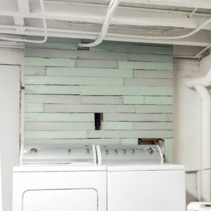 $40 pallet accent wall behind washer and dryer