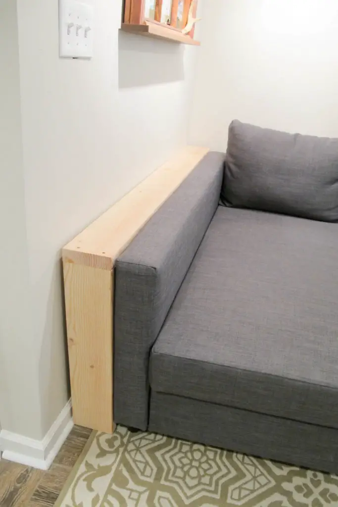 narrow sofa table behind couch