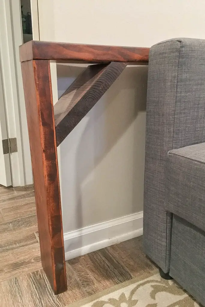 narrow sofa table behind couch